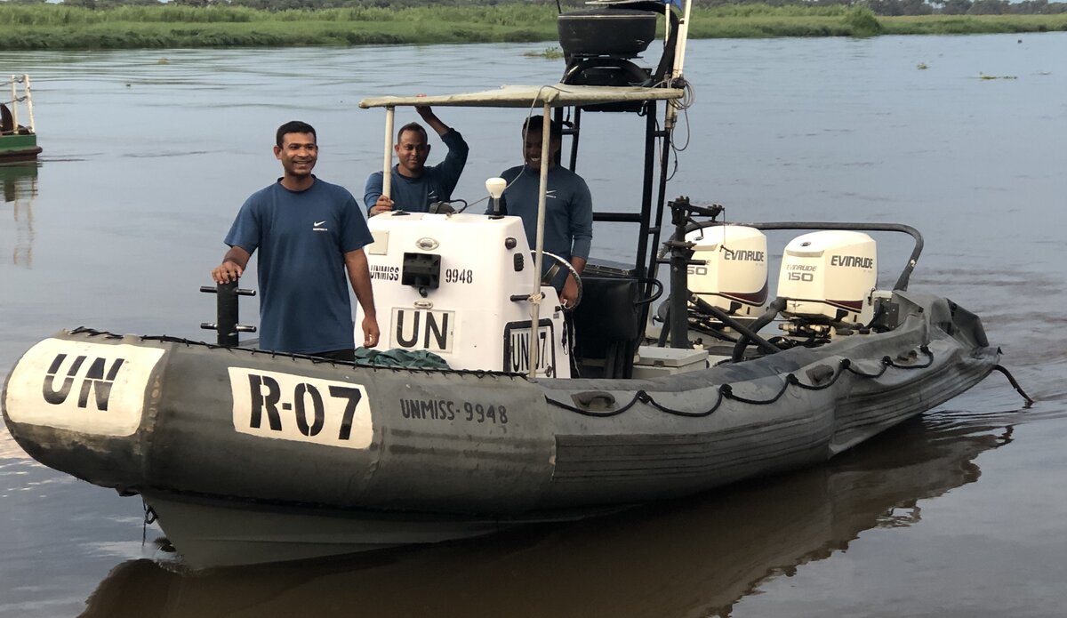 Peace South Sudan UNMISS UN peacekeeping peacekeepers boat patrol riverside Malakal security peaceful cohesion protection of civilians